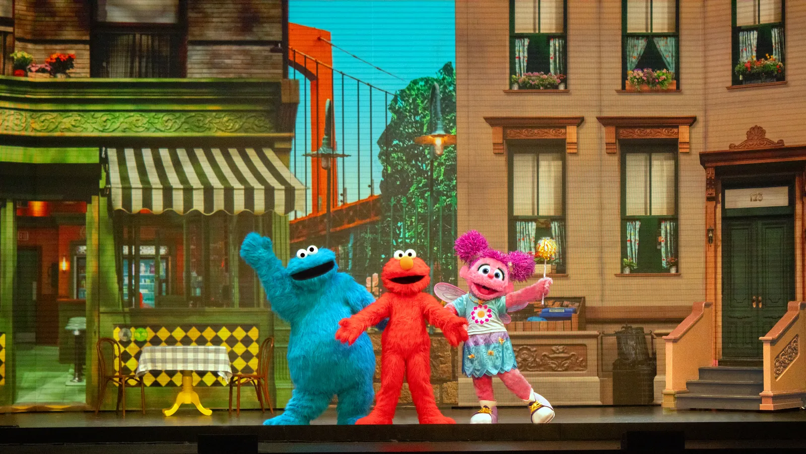 Cookie Monster, Elmo and Abby Cadabby on a Sesame Street Live stage set