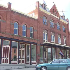The Earlville Opera House, a two-story brick block with arched upper windows on Main Street