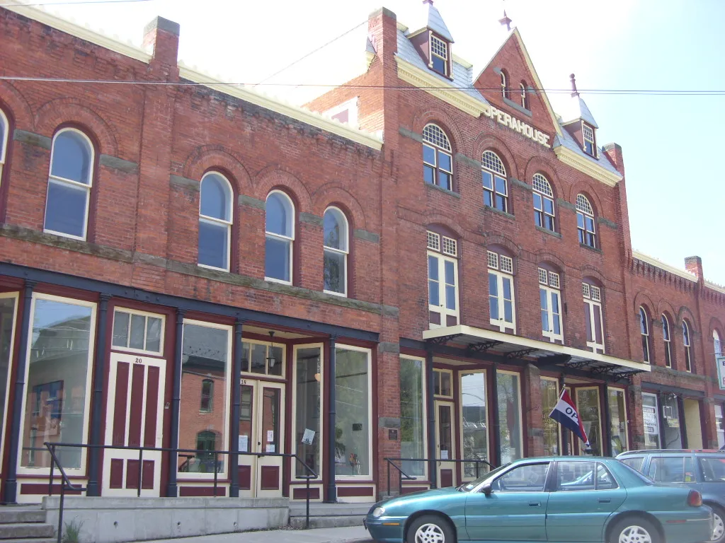 The Earlville Opera House, a two-storey brick block with arched upper windows on Main Street