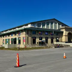 The Coliseum at the New York State Fairgrounds, an arena with a tall arched roof, on an empty March day